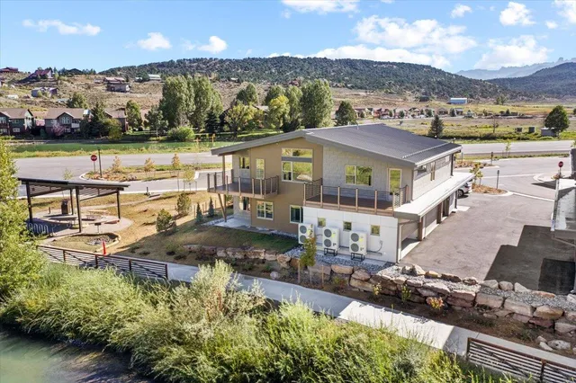 swimming pool view with a lake view