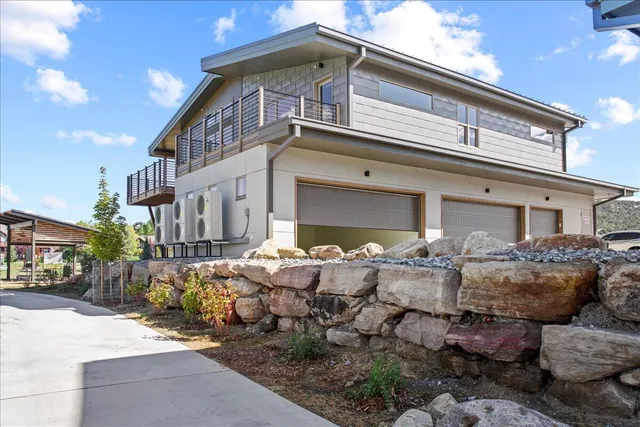 a front view of house with outdoor seating