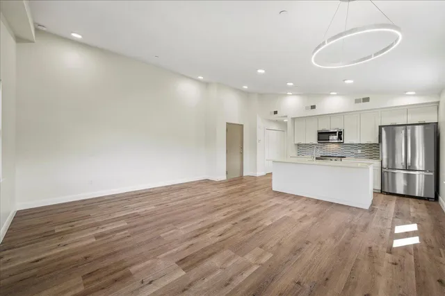 a view of kitchen with wooden floor