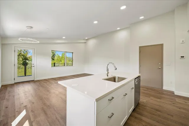 a kitchen with sink and microwave