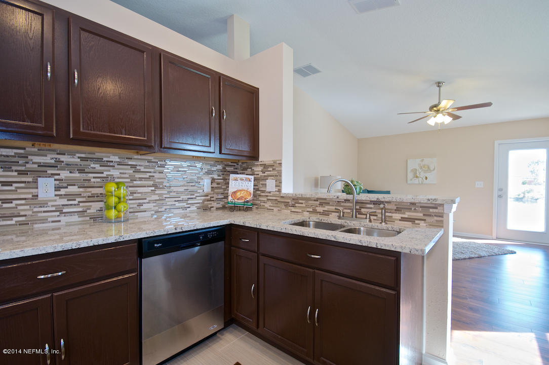 3656 West Star Leaf Road Jacksonville, FL 32210 - Photo 16 of 21 Warm Cabinetry, Glass Backsplash