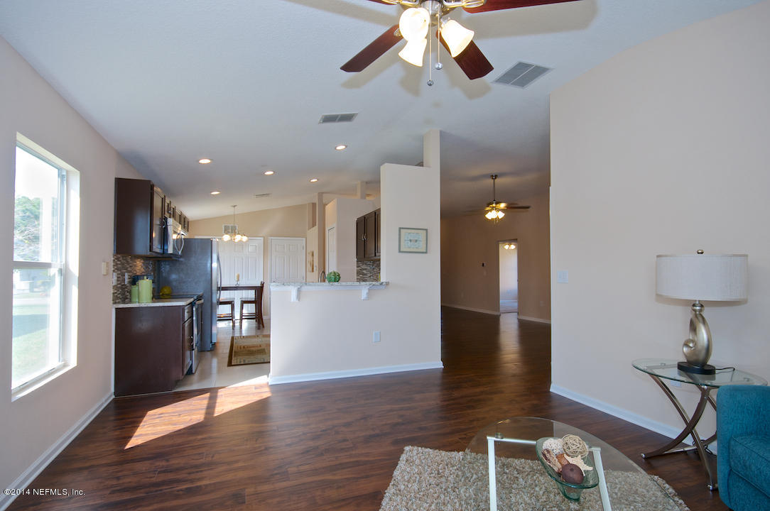 3656 West Star Leaf Road Jacksonville, FL 32210 - Photo 6 of 21 Family Room opens to Kitchen