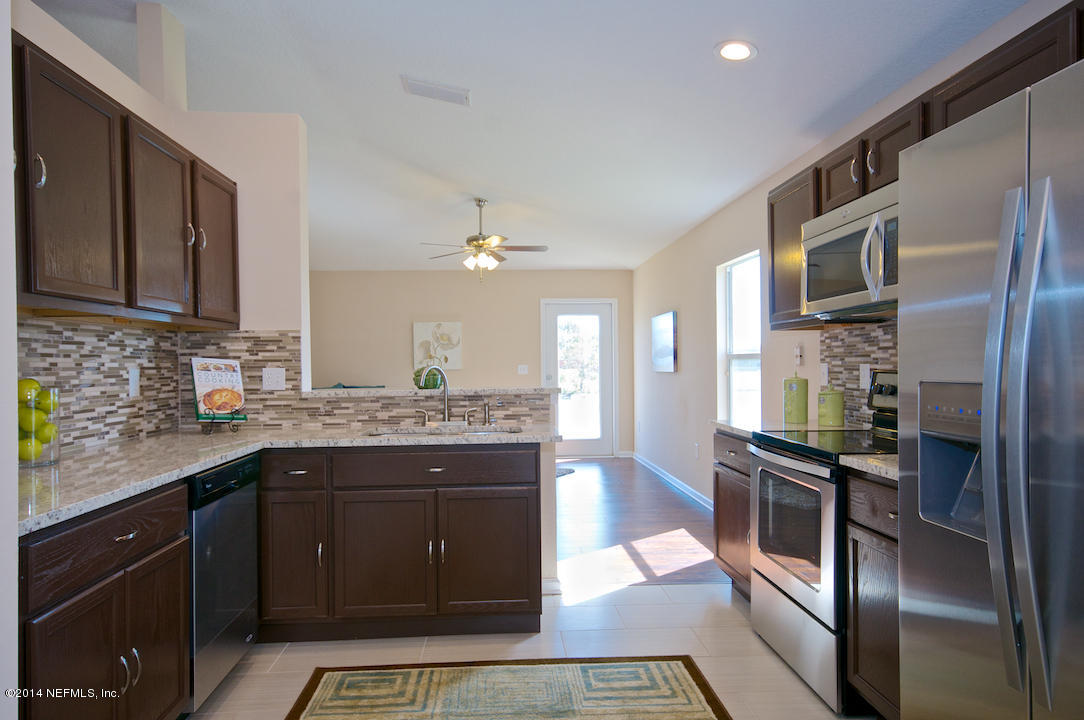 3656 West Star Leaf Road Jacksonville, FL 32210 - Photo 8 of 21 All New Granite & Stainless Kitchen