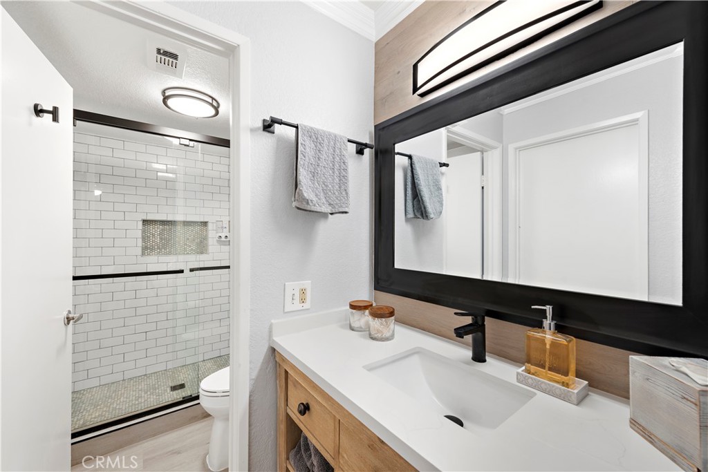 70 Corniche Drive, Unit A Dana Point, CA 92629 - Photo 12 of 58 a bathroom with a sink a toilet and shower