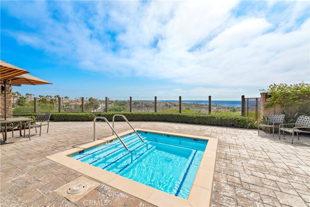 70 Corniche Drive, Unit A Dana Point, CA 92629 - Photo 42 of 58 a view of swimming pool with outdoor seating and city view