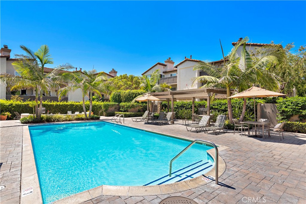70 Corniche Drive, Unit A Dana Point, CA 92629 - Photo 43 of 58 a view of a swimming pool with chairs