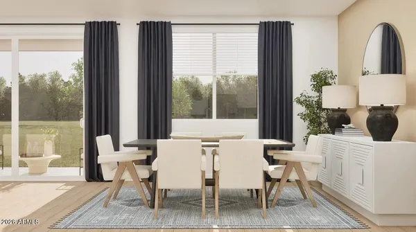 a kitchen with cabinets and wooden floor