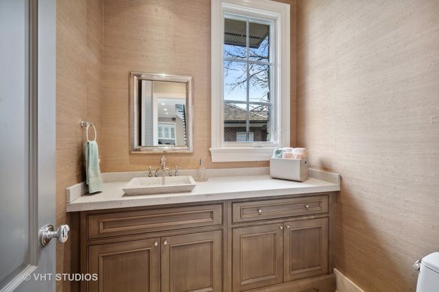 a room with a sink and a refrigerator