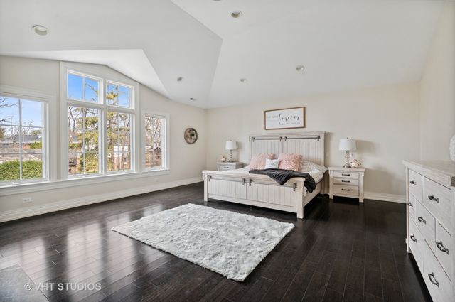 a bedroom with a bed and a fireplace
