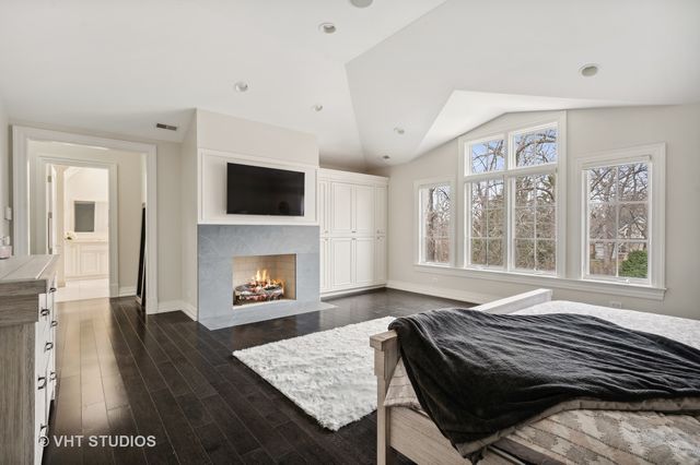 a spacious bathroom with a double vanity sink a mirror and a bathtub