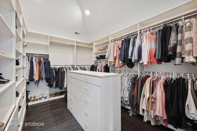 a bathroom with a granite countertop sink a toilet and a shower