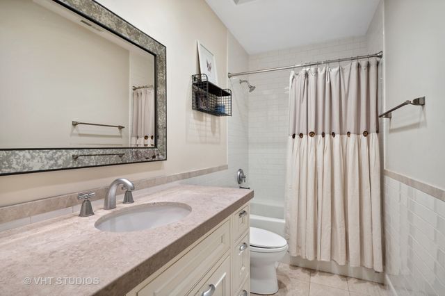 an outdoor sitting area with couch and a umbrella