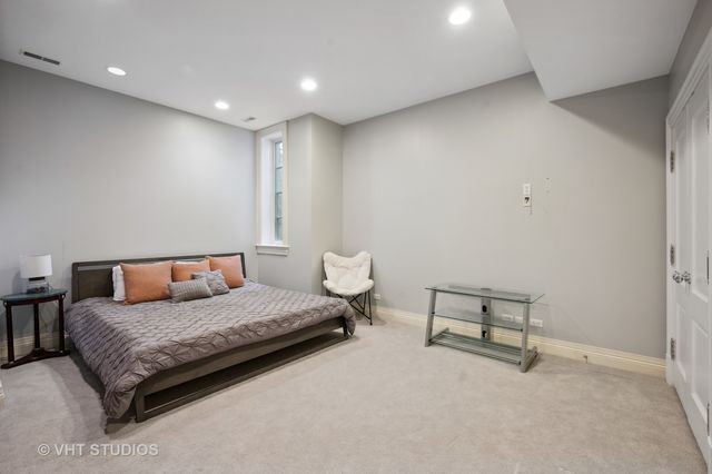 a view of a big yard with table and chairs under an umbrella