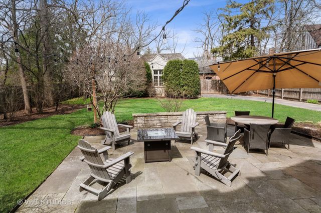 a front view of a house with a garden and yard
