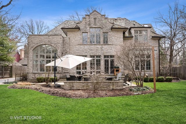 a view of a patio with table and chairs and potted plants