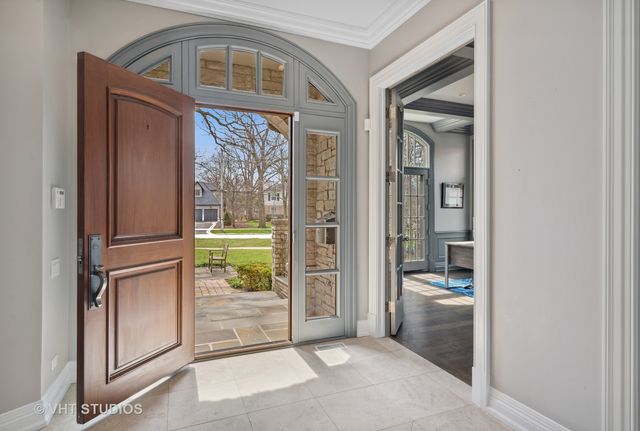 a living room with furniture a flat screen tv and a window