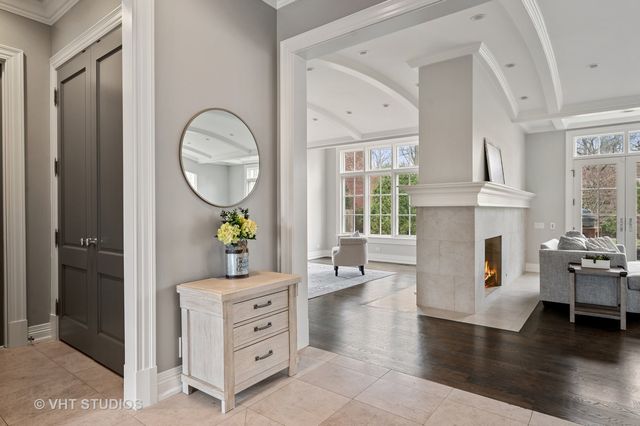 a living room with fireplace furniture and a window