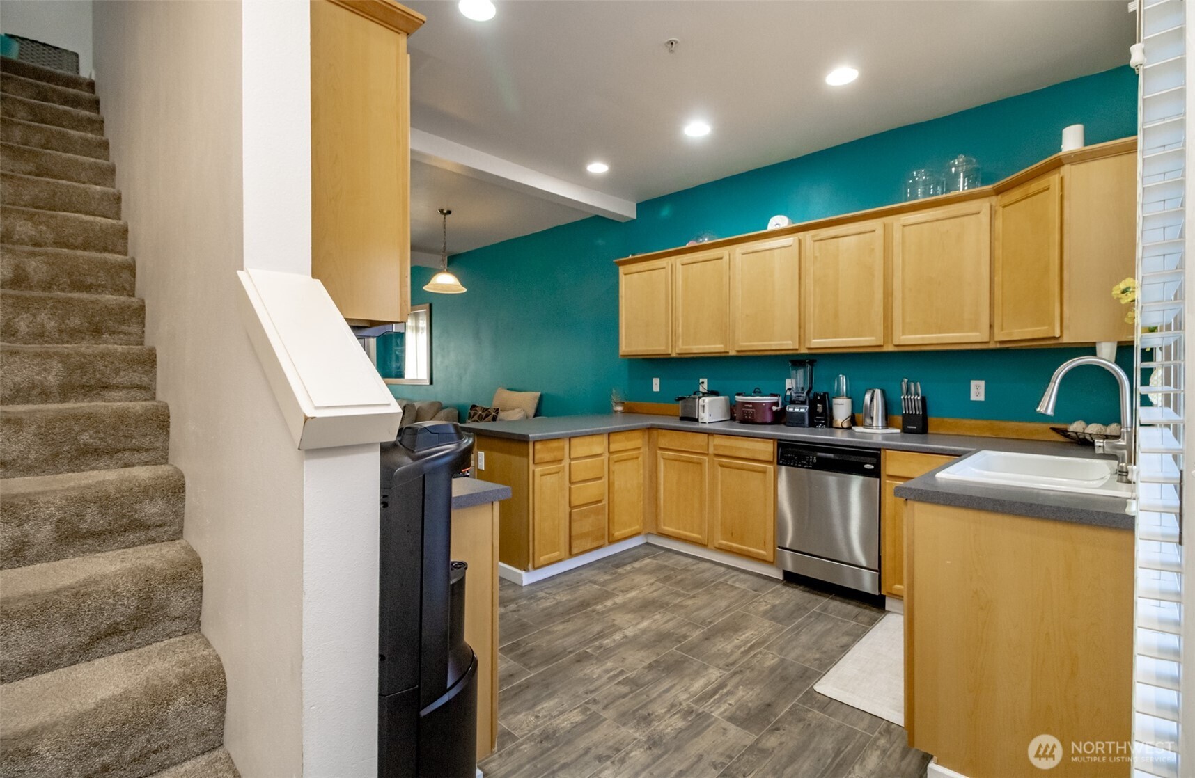 5305 Military Road East, Unit A Tacoma, WA 98446 - Photo 11 of 39 a kitchen with a refrigerator and a sink