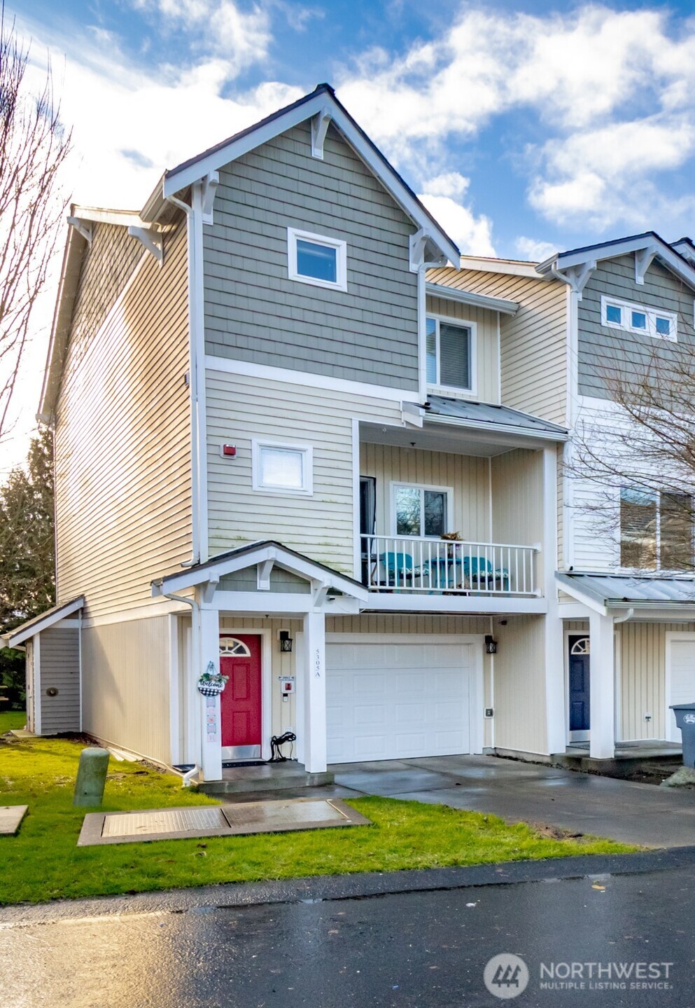 5305 Military Road East, Unit A Tacoma, WA 98446 - Photo 4 of 39 a front view of a house with a yard and garage