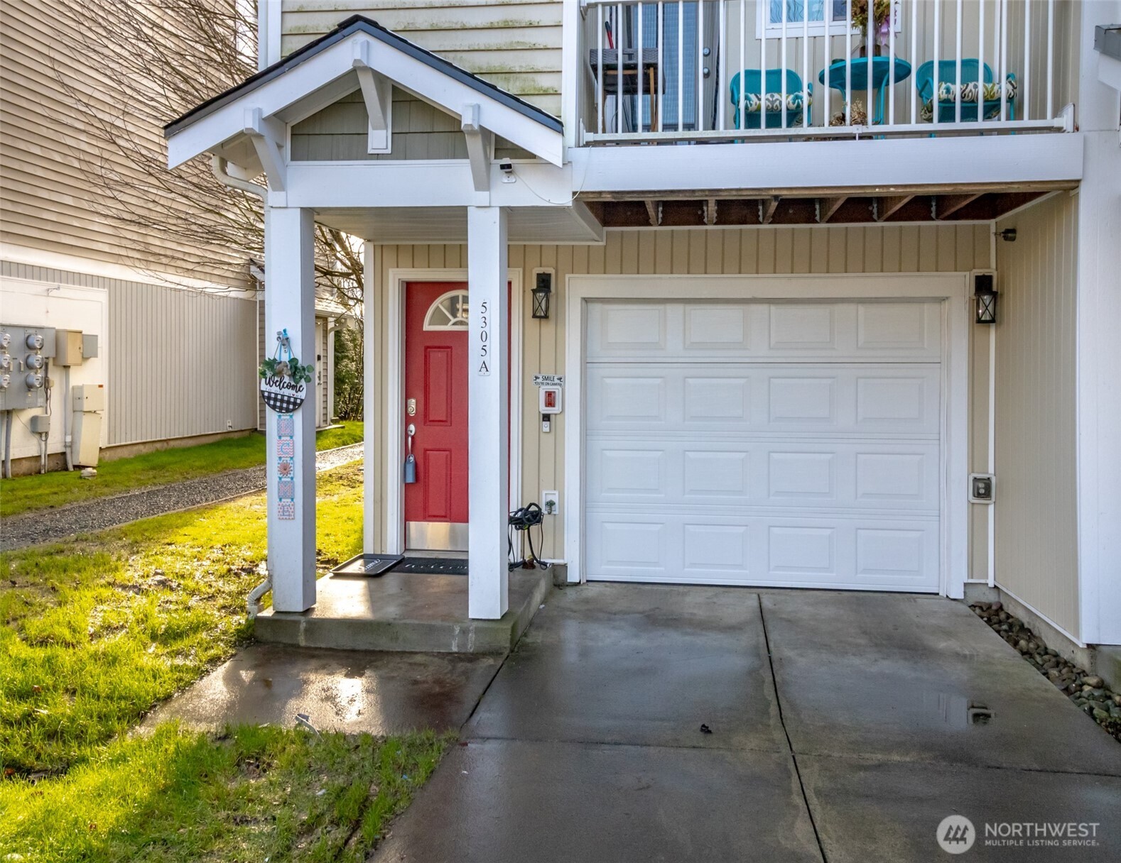 5305 Military Road East, Unit A Tacoma, WA 98446 - Photo 5 of 39 a front view of a house with a yard