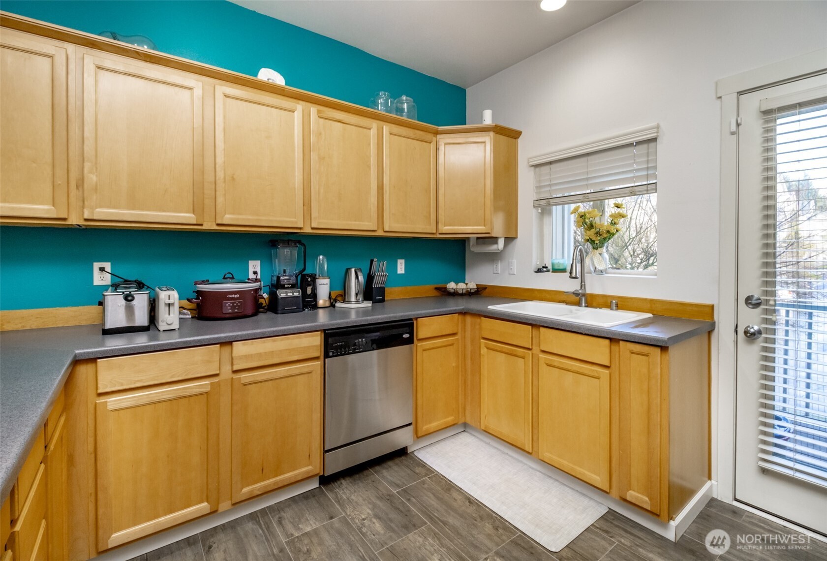 5305 Military Road East, Unit A Tacoma, WA 98446 - Photo 8 of 39 a kitchen with stainless steel appliances granite countertop a sink and cabinets