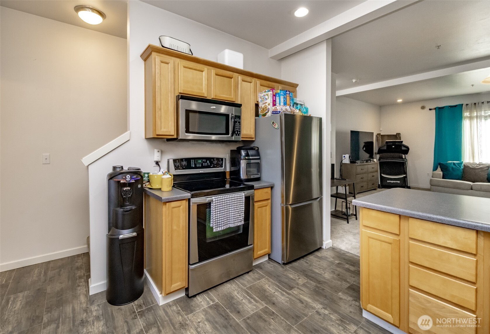 5305 Military Road East, Unit A Tacoma, WA 98446 - Photo 9 of 39 a kitchen with a refrigerator stove and microwave