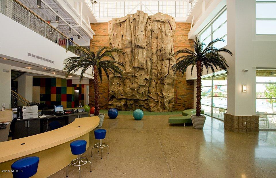6656 West Springfield Way Florence, AZ 85132 - Photo 22 of 26 a view of living room with furniture and floor to ceiling window