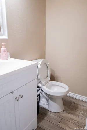 a bathroom with a sink vanity and a mirror