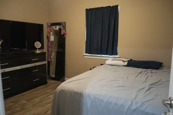 a bedroom with a bed and a walk in closet