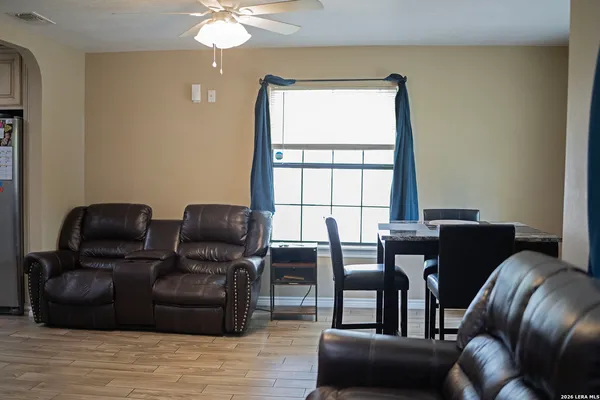 a living room with furniture and a window