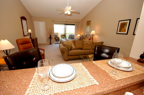 643 Summer Place, Unit 643 Ponte Vedra Beach, FL 32082 - Photo 13 of 15 a living room with furniture a rug and a chandelier