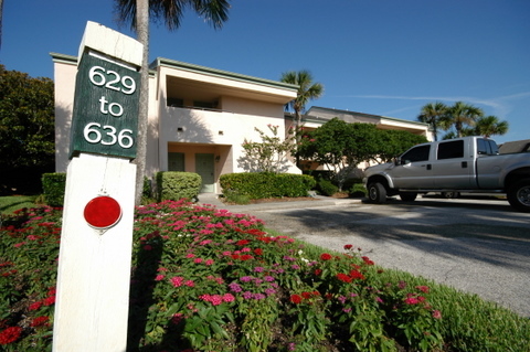 643 Summer Place, Unit 643 Ponte Vedra Beach, FL 32082 - Photo 14 of 15 a view of a house with a yard and potted plants