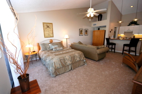 643 Summer Place, Unit 643 Ponte Vedra Beach, FL 32082 - Photo 10 of 15 a spacious bedroom with a bed furniture and a chandelier