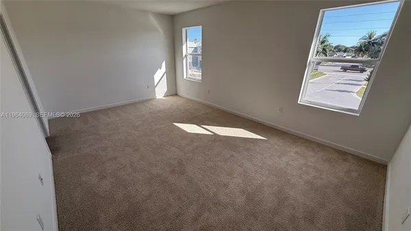 an empty room with windows