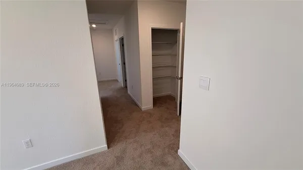 a view of a hallway with closet