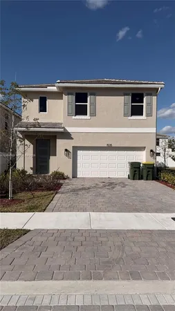 a front view of a house with yard
