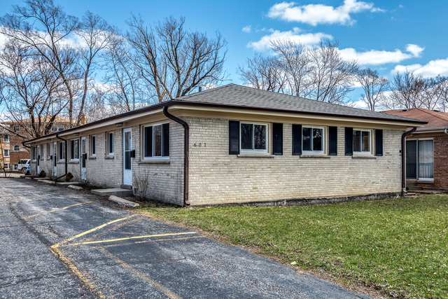601 Highview Avenue Addison, IL 60101 - Photo 2 of 50 a front view of a house with a yard
