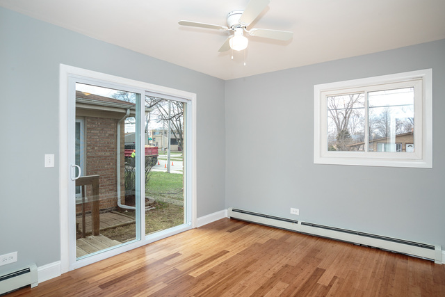601 Highview Avenue Addison, IL 60101 - Photo 12 of 50 wooden floor in an empty room with a window