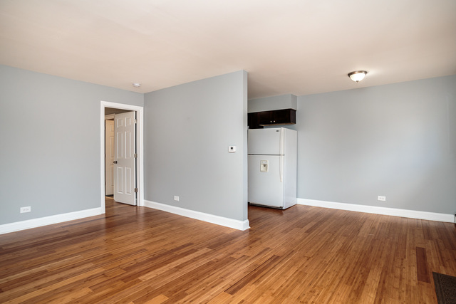 601 Highview Avenue Addison, IL 60101 - Photo 18 of 50 a view of an empty room with wooden floor