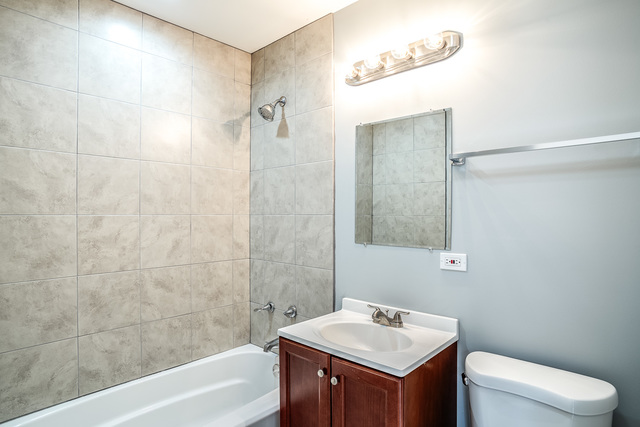 601 Highview Avenue Addison, IL 60101 - Photo 26 of 50 a bathroom with a sink toilet and shower
