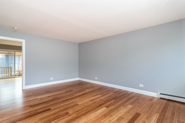 601 Highview Avenue Addison, IL 60101 - Photo 28 of 50 a view of an empty room with wooden floor
