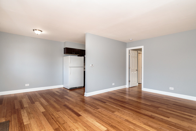 601 Highview Avenue Addison, IL 60101 - Photo 29 of 50 a view of an empty room with wooden floor