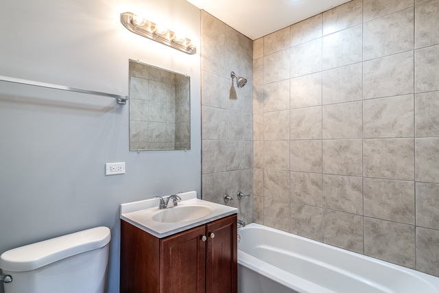 601 Highview Avenue Addison, IL 60101 - Photo 36 of 50 a bathroom with a sink toilet and shower