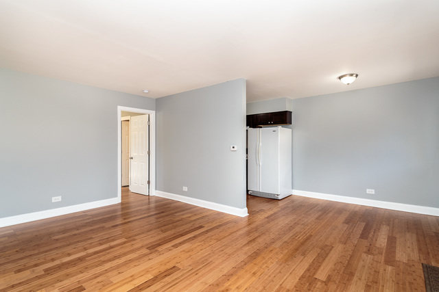 601 Highview Avenue Addison, IL 60101 - Photo 41 of 50 a view of an empty room with wooden floor