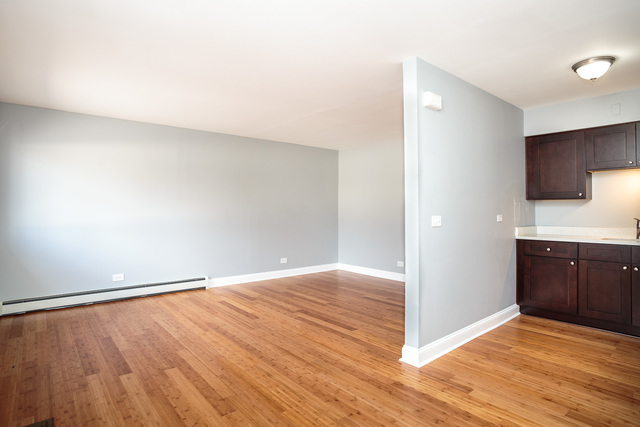 601 Highview Avenue Addison, IL 60101 - Photo 42 of 50 a view of an empty room with wooden floor