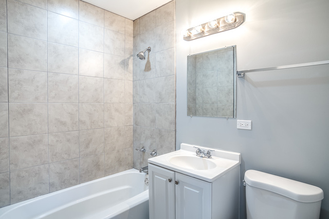 601 Highview Avenue Addison, IL 60101 - Photo 48 of 50 a bathroom with a sink a toilet and shower