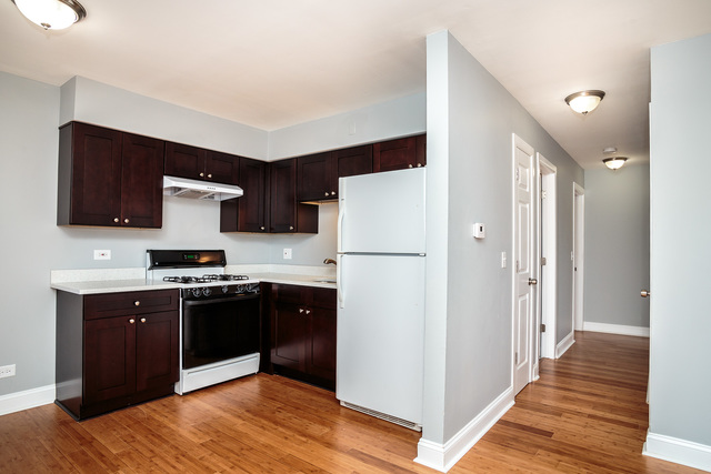 601 Highview Avenue Addison, IL 60101 - Photo 9 of 50 a kitchen with stainless steel appliances granite countertop a refrigerator and a stove