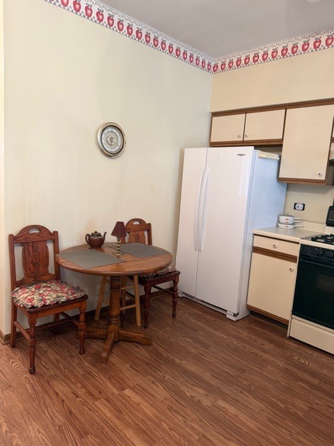 337 Mill Street, Unit 337 Batavia, IL 60510 - Photo 4 of 12 a view of a workspace with furniture and wooden floor