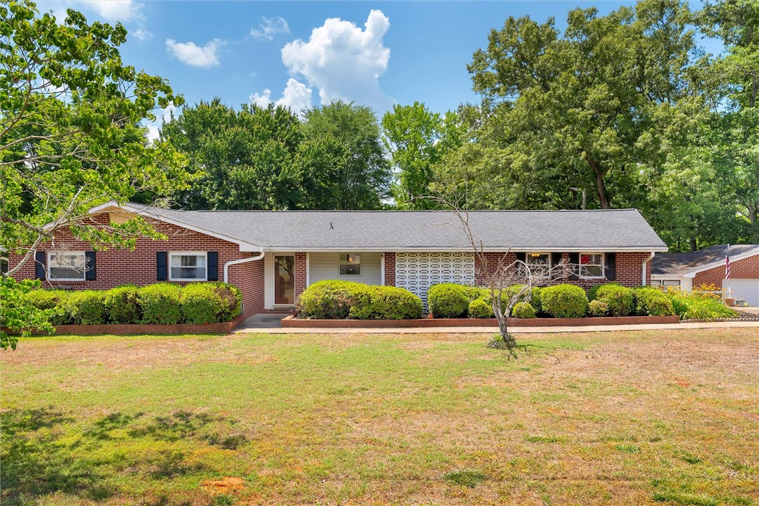 1815 Pearman Dairy Road Anderson, SC 29625 - Photo 1 of 35 A classic brick exterior offers timeless curb appeal with established landscaping.