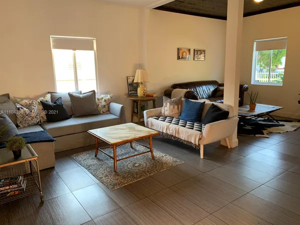 a living room with a couch and a window